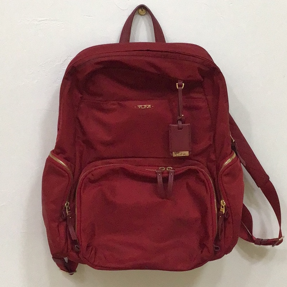 Tumi red backpack
